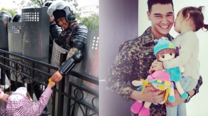 Сайлау күні митингіде Ұлттық гвардия жауынгері мен оған гүл сыйлаған кішкентай қыз кездесті